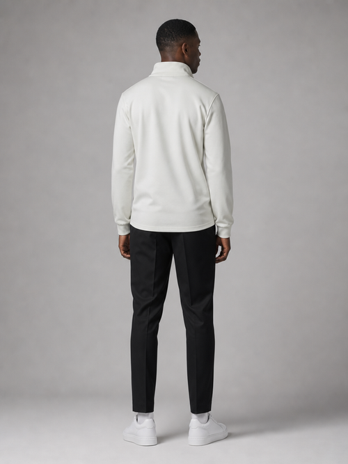 Model wearing the ARME cream quarter zip, back view