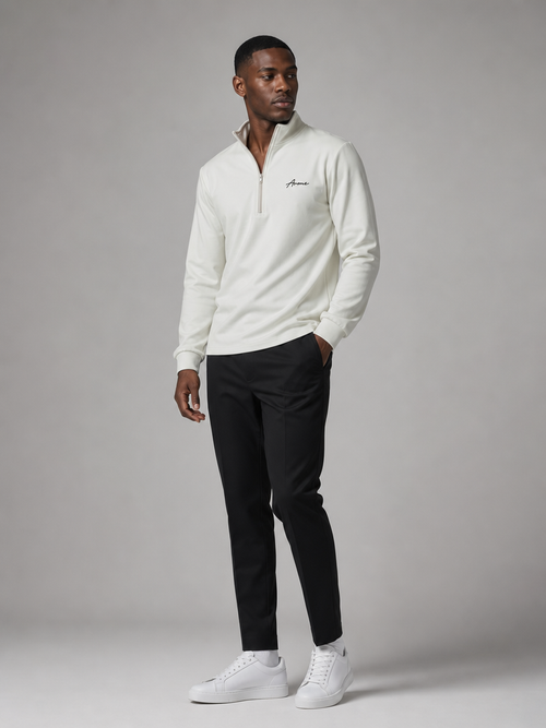 Model wearing the ARME cream quarter zip, front view