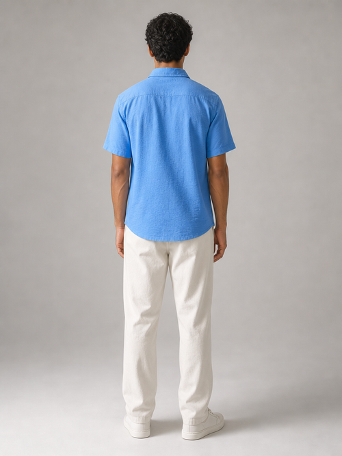 Model wearing the ARME Cuban button-up shirt in baby blue, back view