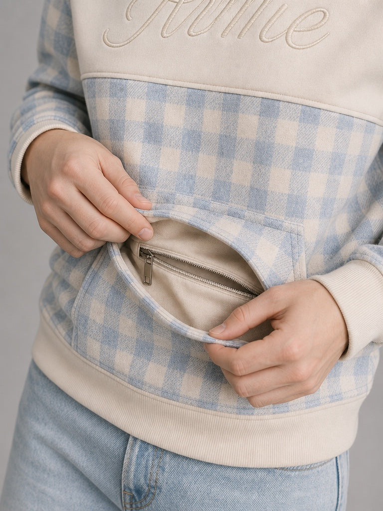 Close-up of ARME gingham hoodie concealed zip pocket