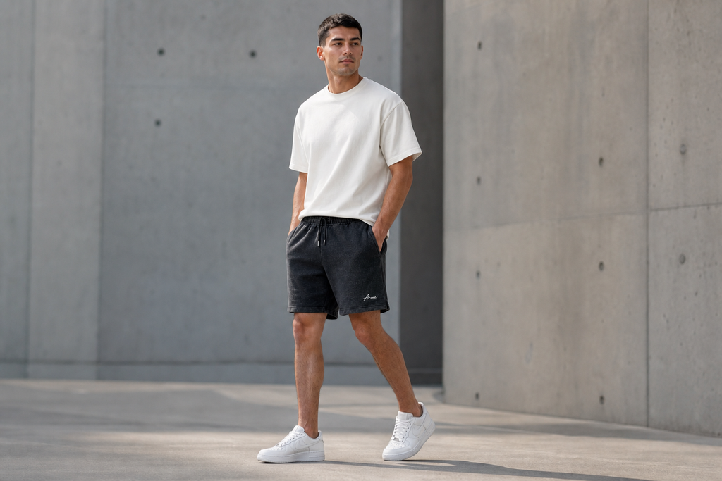 Model wearing ARME charcoal terry shorts, lifestyle view